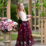 Toddler girl wearing white lace and burgundy floral embroidered  flower girl dress