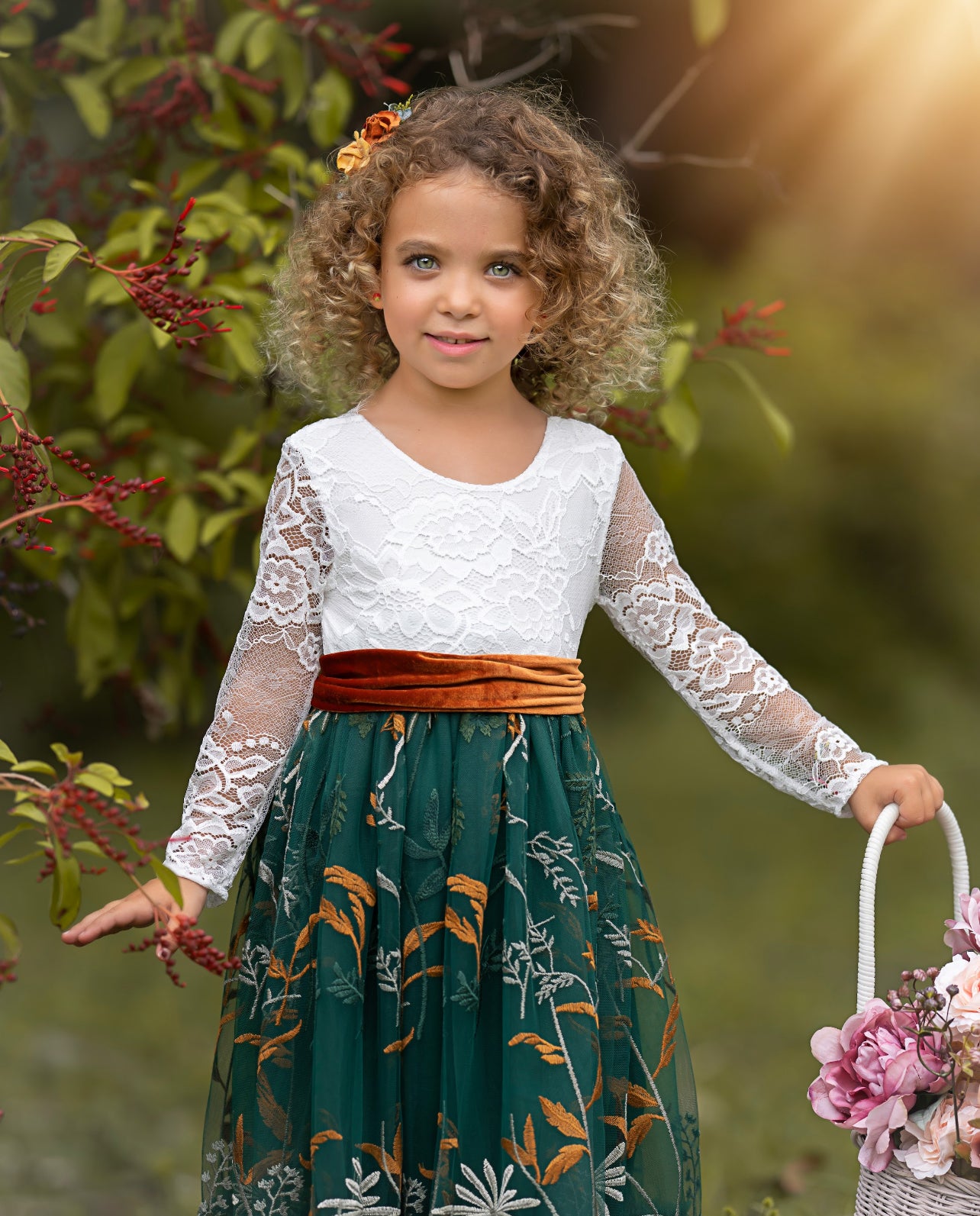 Close-up of floral embroidered hunter green tulle on long sleeve dress