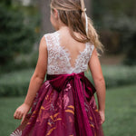 Back view of V-shaped lace back and burgundy velvet bow
