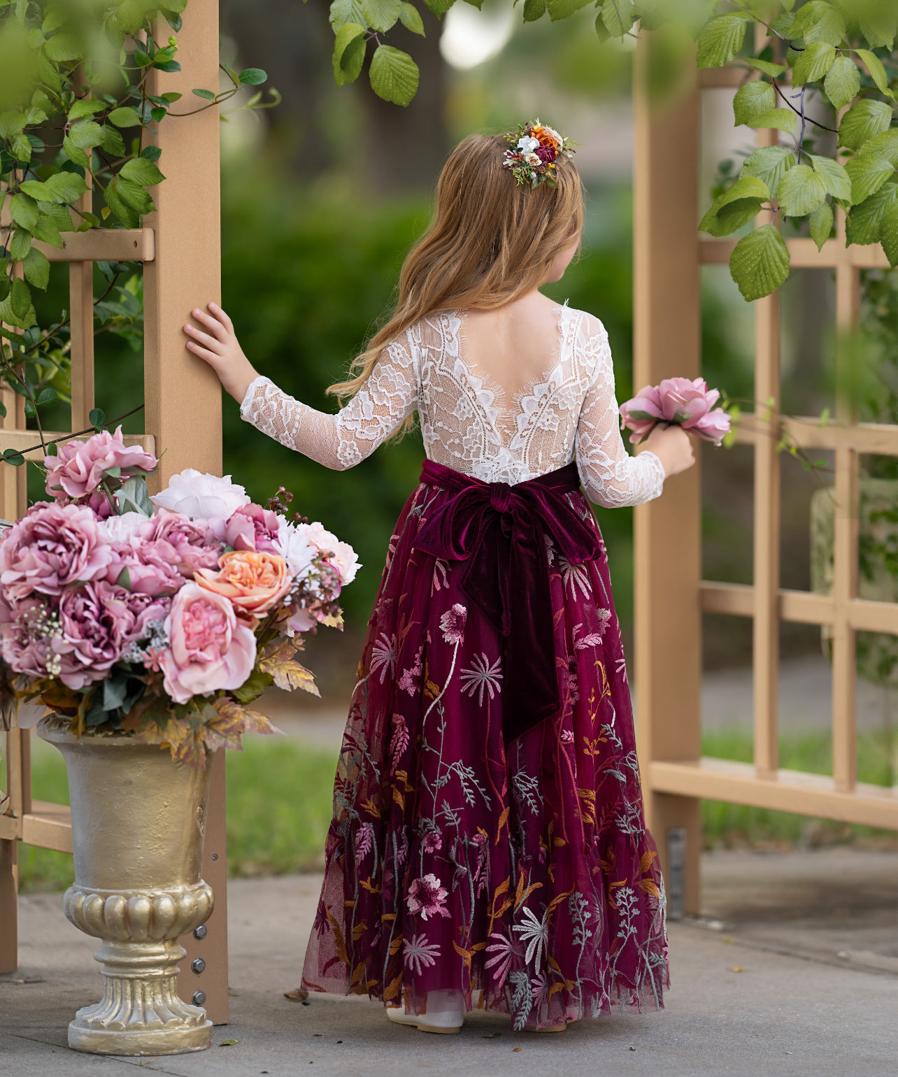 Back view of white lace flower girl dress with burgundy floral embroidered  tulle skirt