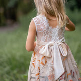 Whimsical flower girl dress with white lace bodice and fall embroidered skirt
