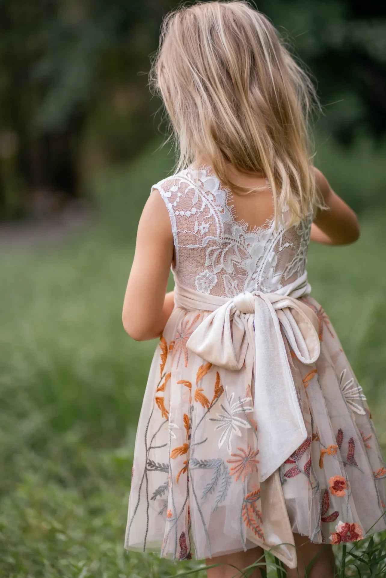 Whimsical flower girl dress with white lace bodice and fall embroidered skirt